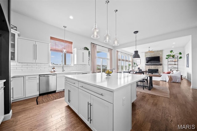 932 Colebrook Ct, Lake St Louis, MO 63367 - kitchen with dishwasher, dark wood-style flooring, a center island, decorative backsplash, and recessed lighting