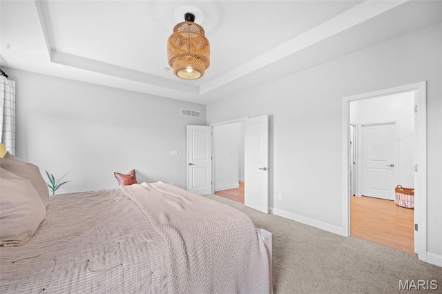 932 Colebrook Ct, Lake St Louis, MO 63367 - carpeted bedroom featuring a raised ceiling and baseboards