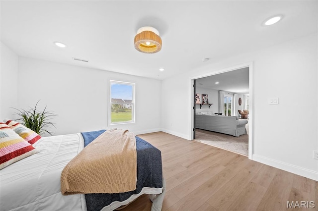 932 Colebrook Ct, Lake St Louis, MO 63367 - bedroom with multiple windows, wood finished floors, and recessed lighting