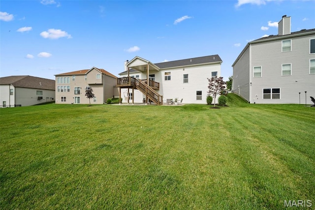 932 Colebrook Ct, Lake St Louis, MO 63367 - back of property featuring stairs, a lawn, and a wooden deck