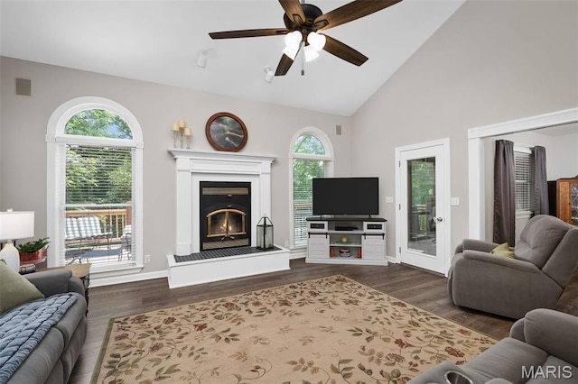 20220 Inverness Dr, Marthasville, MO 63357 - living room featuring dark wood finished floors, a glass covered fireplace, ceiling fan, and high vaulted ceiling