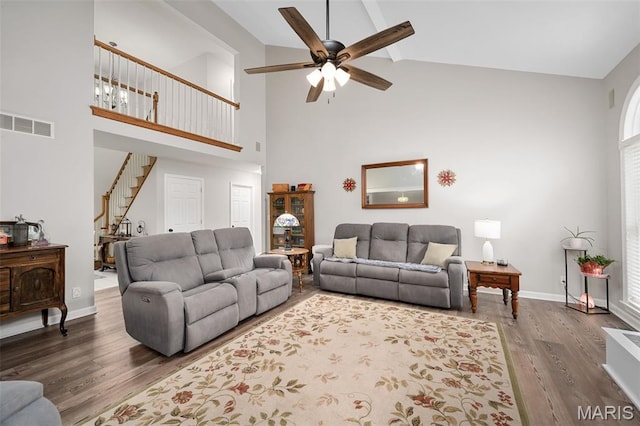 20220 Inverness Dr, Marthasville, MO 63357 - living area featuring high vaulted ceiling, a ceiling fan, wood finished floors, stairway, and beamed ceiling