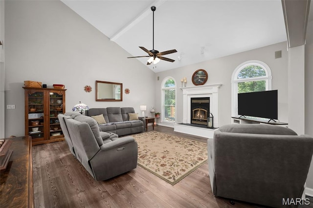 20220 Inverness Dr, Marthasville, MO 63357 - living room featuring dark wood finished floors, a ceiling fan, a glass covered fireplace, high vaulted ceiling, and beamed ceiling
