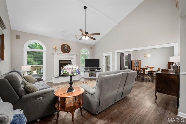20220 Inverness Dr, Marthasville, MO 63357 - living area featuring wood finished floors, a ceiling fan, high vaulted ceiling, and a fireplace with raised hearth