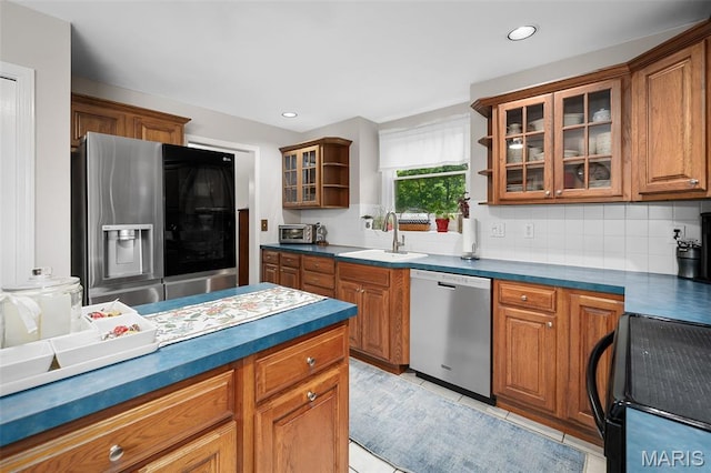 20220 Inverness Dr, Marthasville, MO 63357 - kitchen featuring stainless steel appliances, brown cabinetry, dark countertops, and recessed lighting