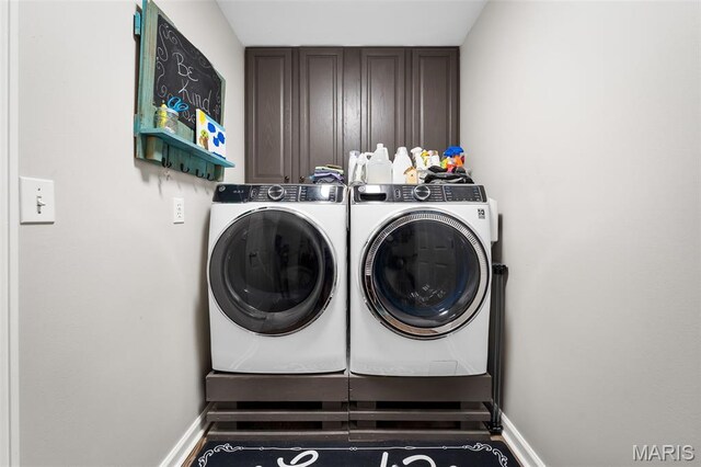 20220 Inverness Dr, Marthasville, MO 63357 - laundry area with washing machine and clothes dryer and cabinet space