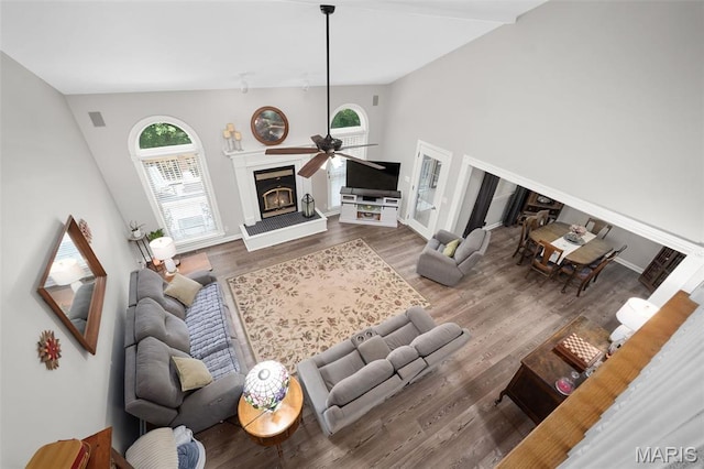 20220 Inverness Dr, Marthasville, MO 63357 - living room with a ceiling fan, a glass covered fireplace, wood finished floors, and high vaulted ceiling