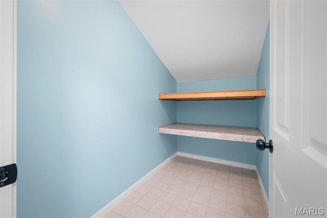 20220 Inverness Dr, Marthasville, MO 63357 - spacious closet with lofted ceiling and light tile patterned flooring