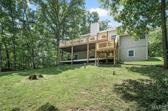 20220 Inverness Dr, Marthasville, MO 63357 - rear view of house with a wooden deck, a lawn, and a chimney
