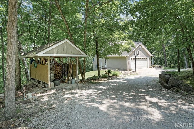 20220 Inverness Dr, Marthasville, MO 63357 - exterior space with gravel driveway and a garage