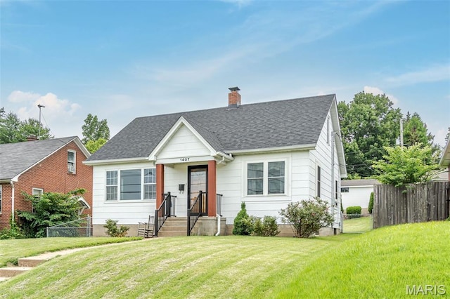 1407 E 5th St, Washington, MO 63090 - bungalow with a chimney and roof with shingles