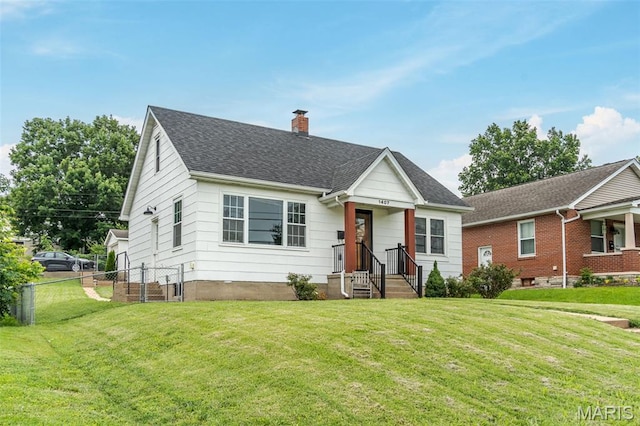 1407 E 5th St, Washington, MO 63090 - bungalow-style home with a chimney and roof with shingles
