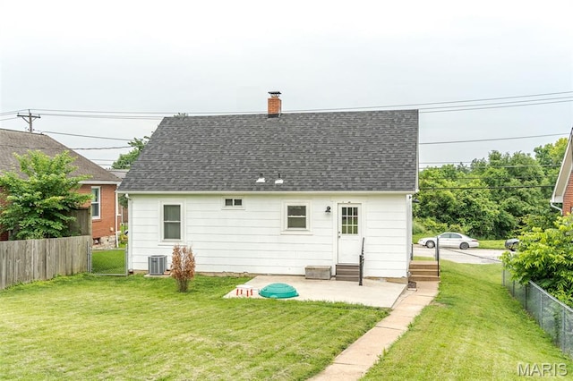 1407 E 5th St, Washington, MO 63090 - back of property with entry steps, a fenced backyard, a shingled roof, and a chimney
