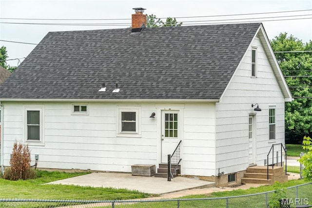 1407 E 5th St, Washington, MO 63090 - back of property featuring entry steps, a shingled roof, a chimney, and a patio area
