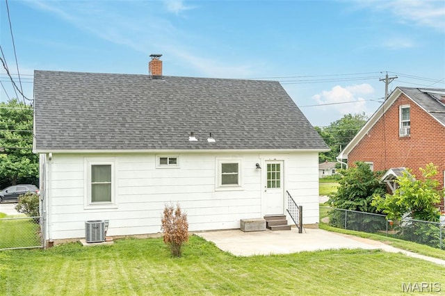 1407 E 5th St, Washington, MO 63090 - back of property with entry steps, a chimney, a patio area, and roof with shingles