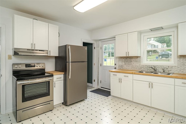 1407 E 5th St, Washington, MO 63090 - kitchen featuring stainless steel appliances, wooden counters, under cabinet range hood, and light flooring