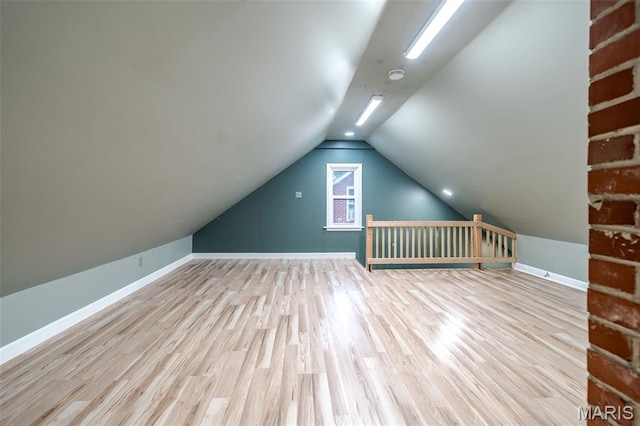 1407 E 5th St, Washington, MO 63090 - additional living space featuring wood finished floors and vaulted ceiling