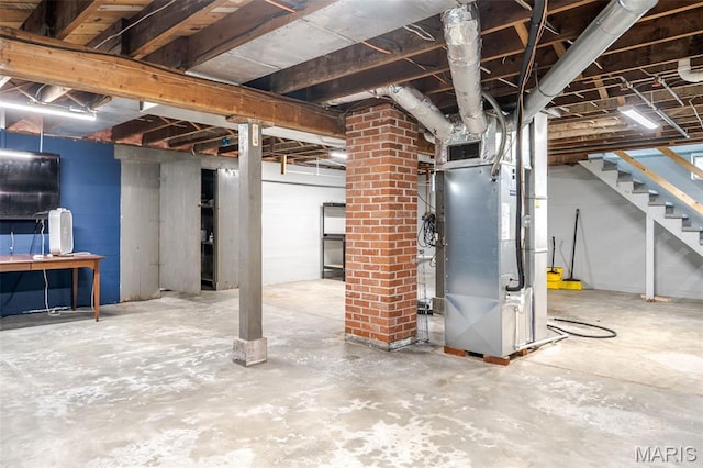 1407 E 5th St, Washington, MO 63090 - unfinished basement featuring heating unit and stairs
