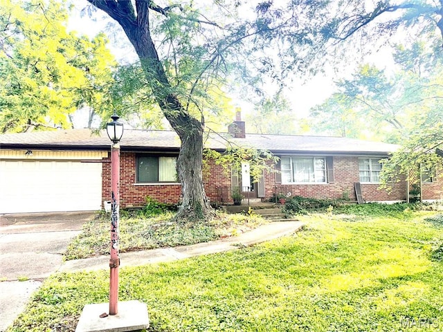 8361 Latty Ave, Hazelwood, MO 63042 - single story home featuring an attached garage, concrete driveway, brick siding, a front yard, and a chimney