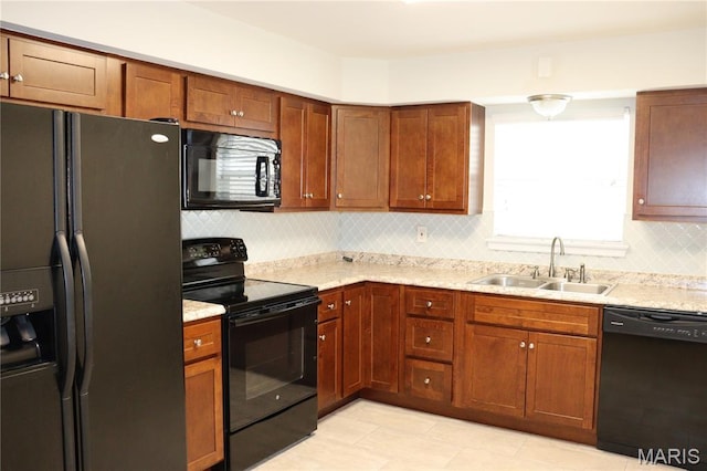 12574 Chardin Pl Unit 1, Tesson Ferry Township, MO 63128 - kitchen featuring black appliances, tasteful backsplash, light stone countertops, and brown cabinets