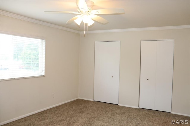 12574 Chardin Pl Unit 1, Tesson Ferry Township, MO 63128 - unfurnished bedroom featuring ornamental molding, carpet floors, multiple closets, and ceiling fan