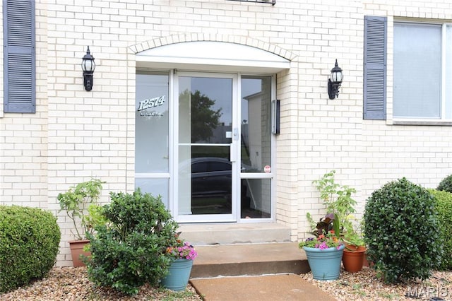 12574 Chardin Pl Unit 1, Tesson Ferry Township, MO 63128 - entrance to property with brick siding