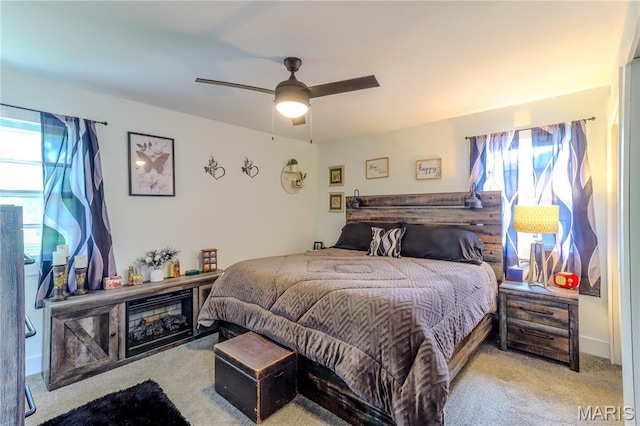 1304 Highland Dr, Rolla, MO 65401 - bedroom featuring carpet floors, multiple windows, and a ceiling fan