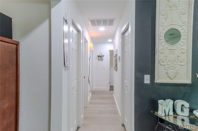 1304 Highland Dr, Rolla, MO 65401 - corridor featuring light wood-type flooring and baseboards