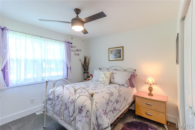 1304 Highland Dr, Rolla, MO 65401 - bedroom featuring dark carpet and a ceiling fan