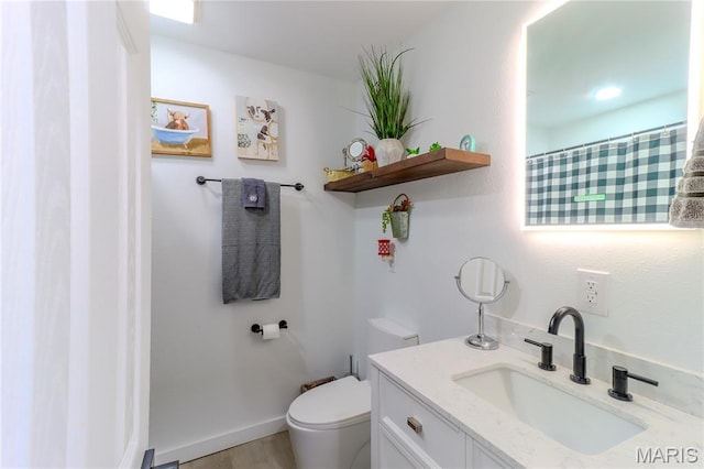 1304 Highland Dr, Rolla, MO 65401 - full bathroom with vanity and wood finished floors
