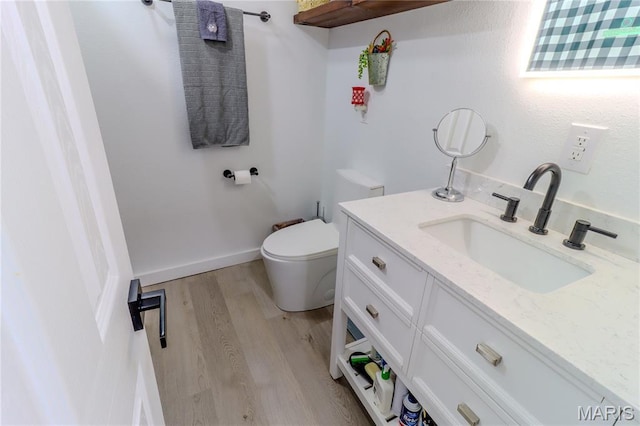 1304 Highland Dr, Rolla, MO 65401 - half bathroom with vanity and wood finished floors