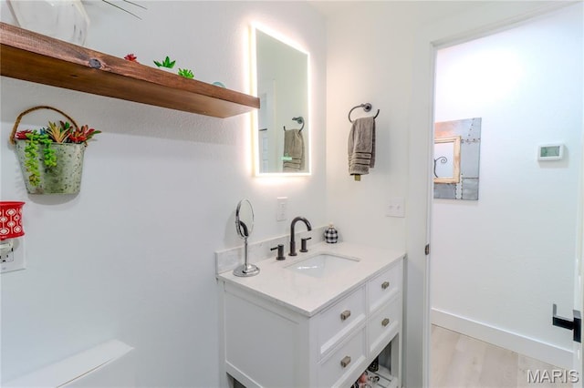 1304 Highland Dr, Rolla, MO 65401 - bathroom with vanity and wood finished floors