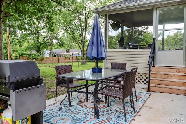 1304 Highland Dr, Rolla, MO 65401 - view of patio / terrace featuring outdoor dining area, area for grilling, and a sunroom