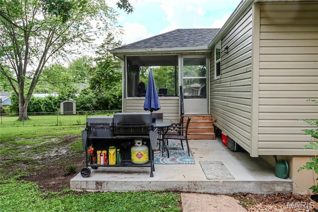 1304 Highland Dr, Rolla, MO 65401 - view of patio with entry steps and a sunroom