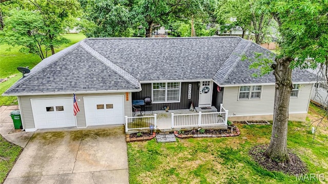 1304 Highland Dr, Rolla, MO 65401 - single story home with a shingled roof, an attached garage, concrete driveway, a front yard, and covered porch