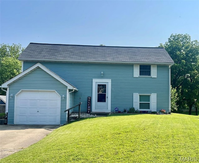 121 Walnut Ridge Dr, Bethalto, IL 62010 - view of front of house featuring a front yard, concrete driveway, and a garage