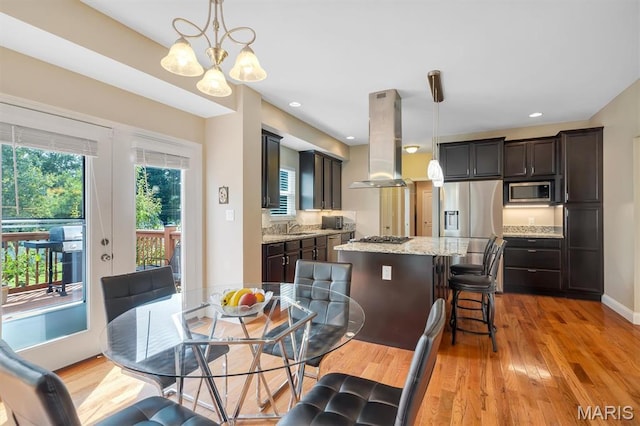 306 Essen Ln, Ballwin, MO 63021 - dining area featuring light wood-style flooring, a chandelier, and recessed lighting