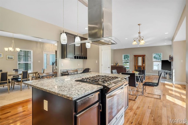 306 Essen Ln, Ballwin, MO 63021 - kitchen featuring gas stove, a chandelier, island range hood, light wood-type flooring, and recessed lighting