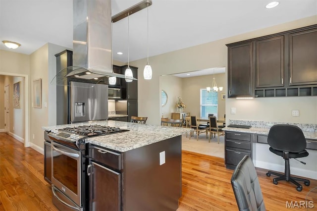 306 Essen Ln, Ballwin, MO 63021 - kitchen featuring appliances with stainless steel finishes, island exhaust hood, light wood-style floors, and dark brown cabinetry