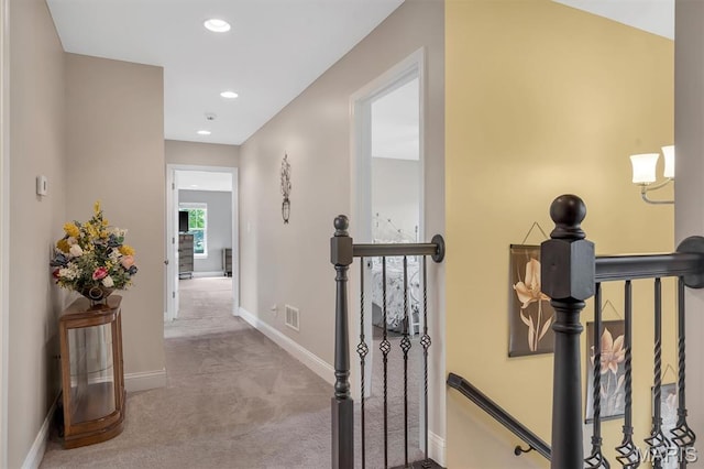 306 Essen Ln, Ballwin, MO 63021 - hallway featuring an upstairs landing, carpet flooring, and recessed lighting