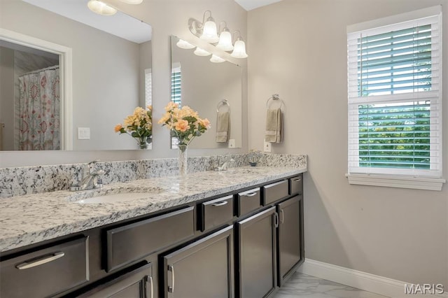306 Essen Ln, Ballwin, MO 63021 - bathroom with marble finish flooring and double vanity