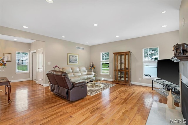 306 Essen Ln, Ballwin, MO 63021 - living area with light wood-style floors, healthy amount of natural light, and recessed lighting