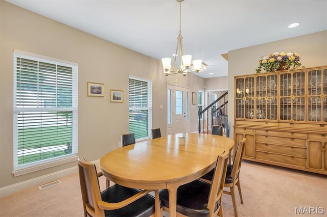306 Essen Ln, Ballwin, MO 63021 - dining space with light colored carpet, a chandelier, stairway, and recessed lighting