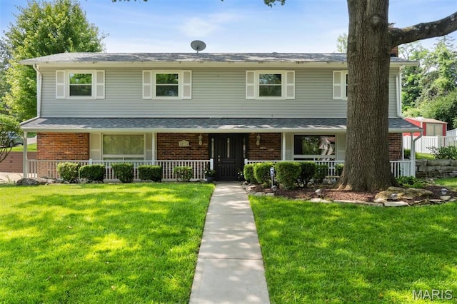12330 Cape Cod Dr, Creve Coeur Township, MO 63146 - view of front of home featuring covered porch, brick siding, and a front yard