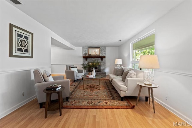 12330 Cape Cod Dr, Creve Coeur Township, MO 63146 - living area with a large fireplace and wood finished floors