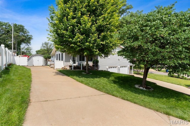 12330 Cape Cod Dr, Creve Coeur Township, MO 63146 - obstructed view of property with a storage unit, concrete driveway, and a garage