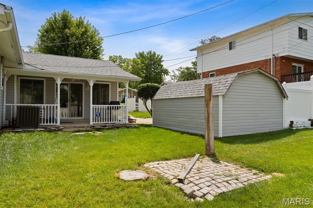 12330 Cape Cod Dr, Creve Coeur Township, MO 63146 - view of grassy yard with covered porch and a storage unit