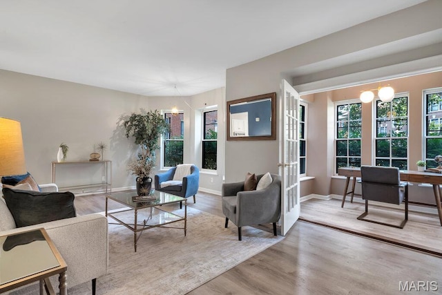 5858 Nina Pl # 1W, Saint Louis, MO 63112 - living area featuring wood finished floors and an office area