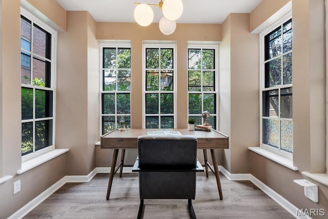 5858 Nina Pl # 1W, Saint Louis, MO 63112 - office area featuring wood finished floors and a chandelier