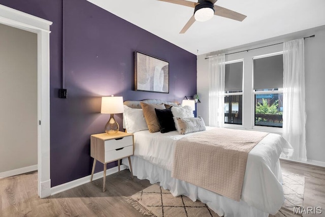 5858 Nina Pl # 1W, Saint Louis, MO 63112 - bedroom featuring wood finished floors and a ceiling fan